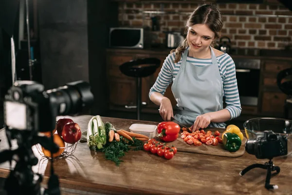 Young Food Blogger Cutting Cherry Tomatoes Wooden Board — Stock Photo, Image