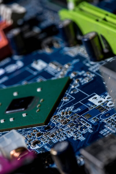close up view of computer motherboard with chip