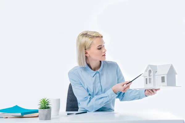 Portrait Real Estate Agent Pointing House Model Hand Workplace — Stock Photo, Image