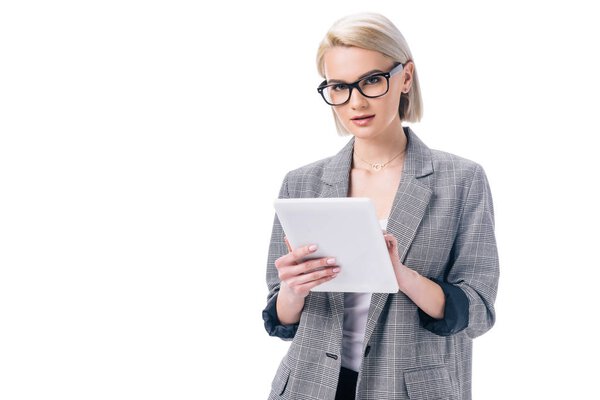 attractive businesswoman in glasses using digital tablet, isolated on white