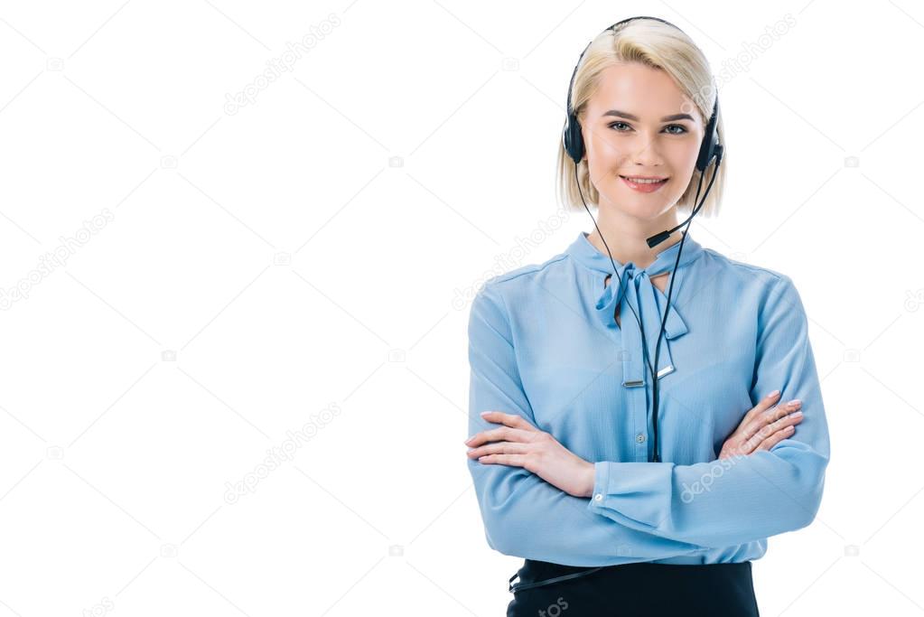 attractive operator with crossed arms working in headset, isolated on white