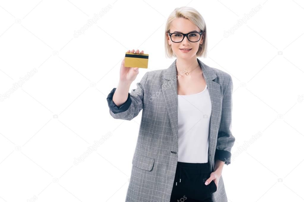 attractive stylish businesswoman showing credit card, isolated on white