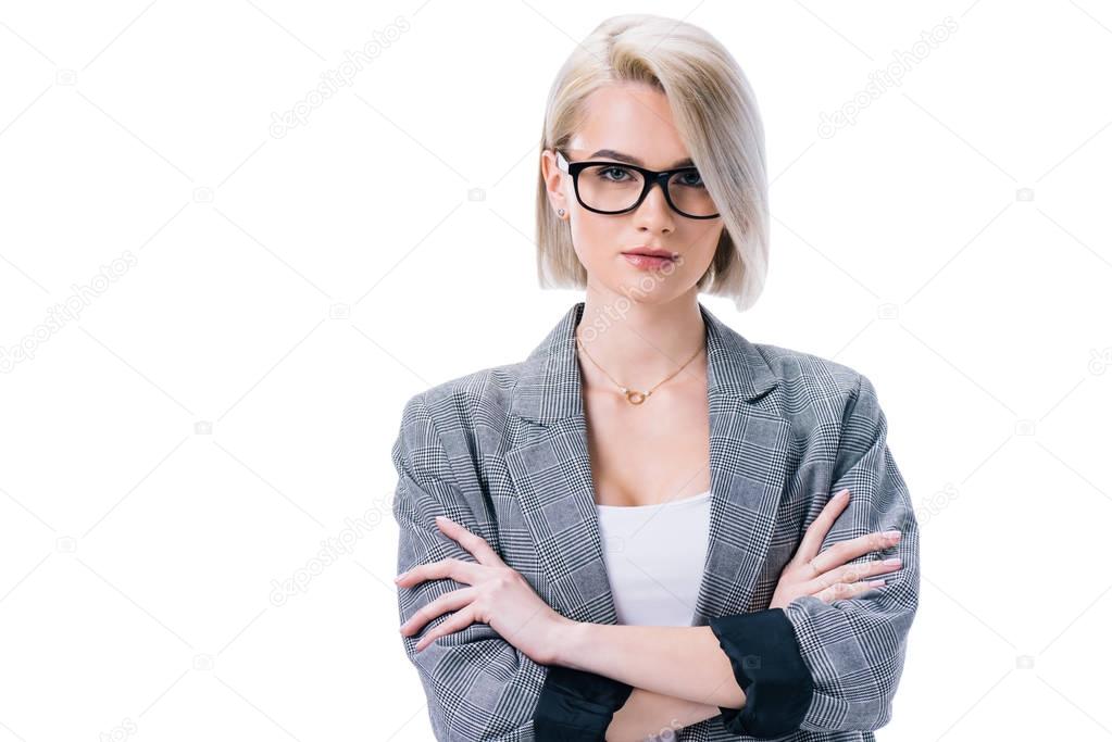 attractive businesswoman in eyeglasses with crossed arms, isolated on white