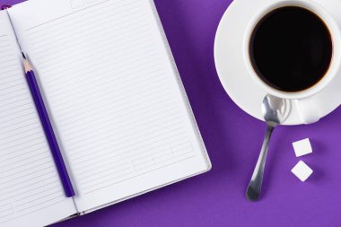 top view of workspace with opened blank notebook and coffee cup clipart