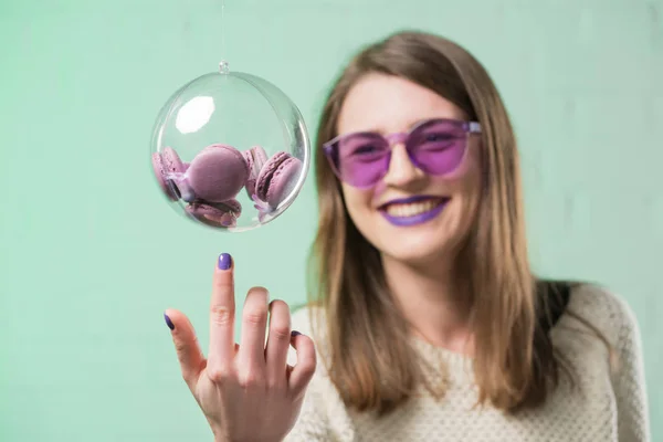 Happy Young Woman Pink Eyeglasses Touching Glass Ball Macarons — Stock Photo, Image