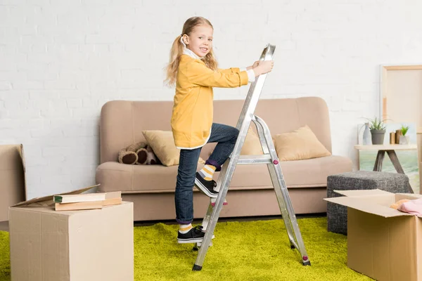 Cute Little Child Standing Ladder Smiling Camera Relocation — Stock Photo, Image