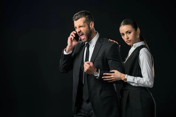 Angry Boss Yelling While Talking Smartphone Businesswoman Standing Isolated Black — Stock Photo, Image