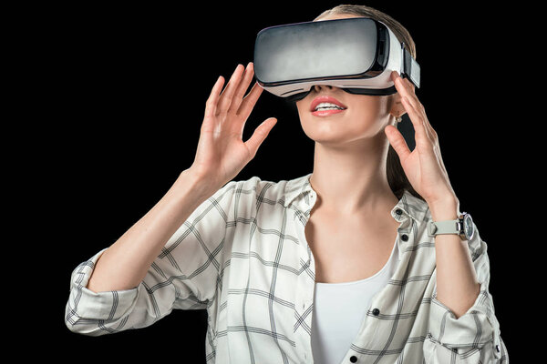 woman using virtual reality headset, isolated on black