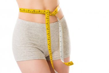 cropped shot of woman with measuring tape tied around her waist isolated on white clipart