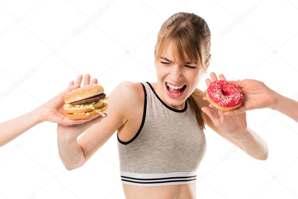 young slim woman refusing of junk food isolated on white