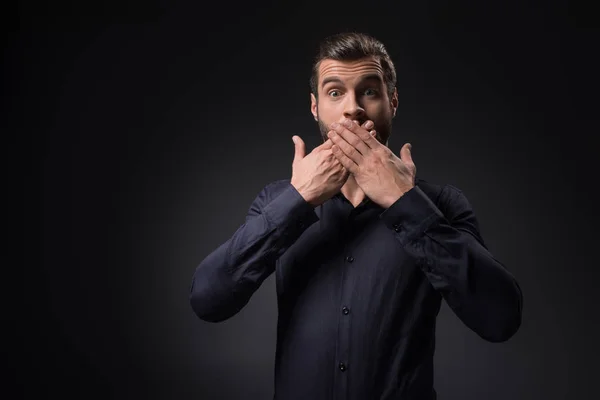 Portrait Shocked Man Covering Mouth Hands Isolated Black — Stock Photo, Image