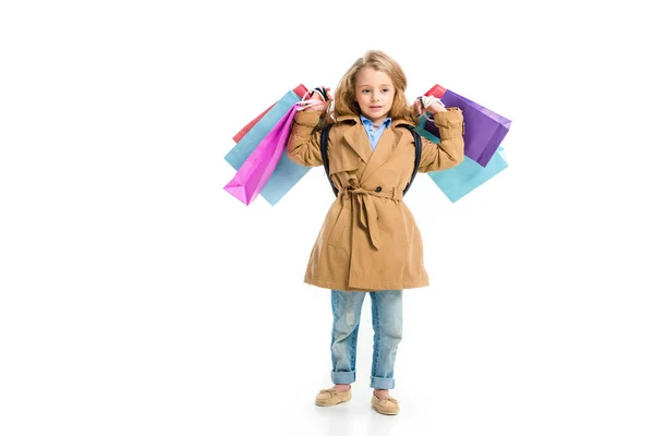 Criança Casaco Trincheira Com Diferentes Sacos Compras Mãos Isoladas Branco — Fotografia de Stock