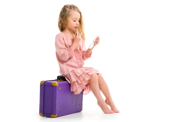 Side View Stylish Child Sitting Suitcase Doing Makeup Lipstick Isolated — Stock Photo, Image