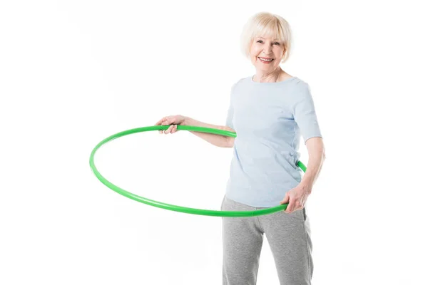 Senior Sportswoman Doing Hula Hoop Exercise Isolated White — Free Stock Photo