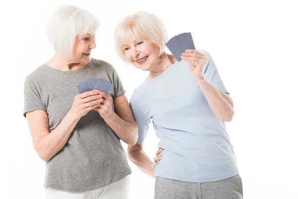 Two Senior Smiling Sportswomen Playing Cards Isolated White — Stock Photo, Image