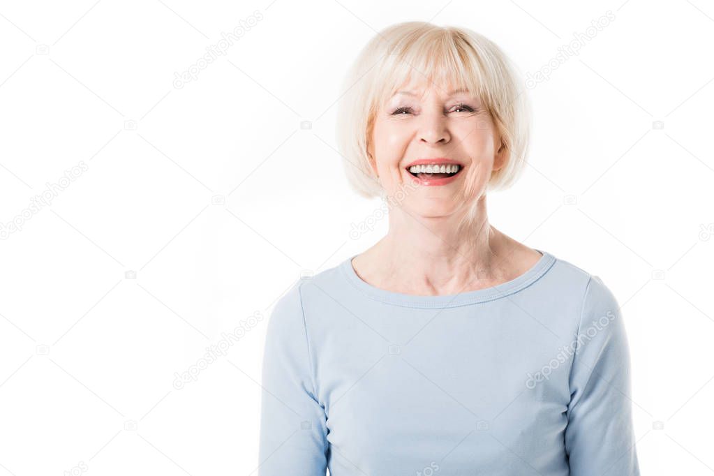 Portrait of smiling senior woman isolated on white