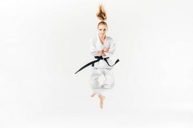 female karate fighter jumping isolated on white clipart