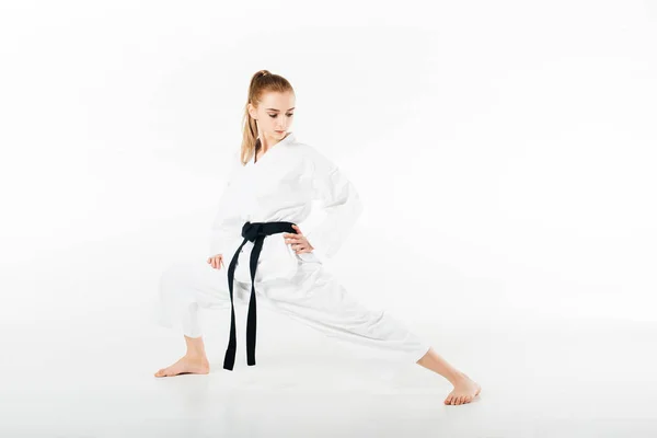 Female Karate Fighter Stretching Legs Isolated White — Stock Photo, Image