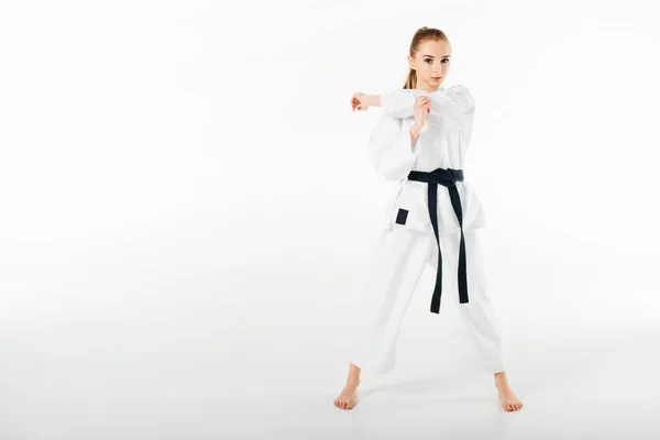 Kvinnliga Karate Fighter Stretching Händer Och Tittar Kameran Isolerad Vit — Stockfoto