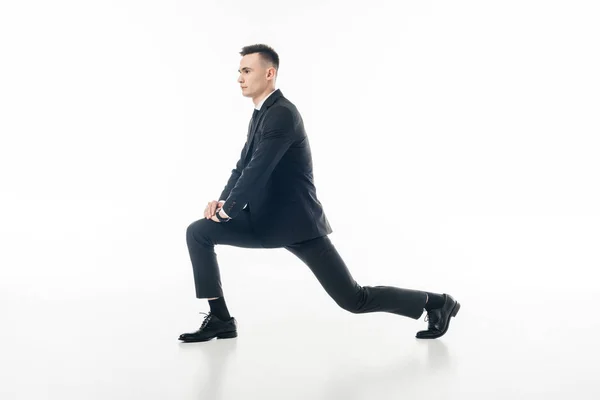 Businessman Stretching Legs Suit Isolated White — Stock Photo, Image