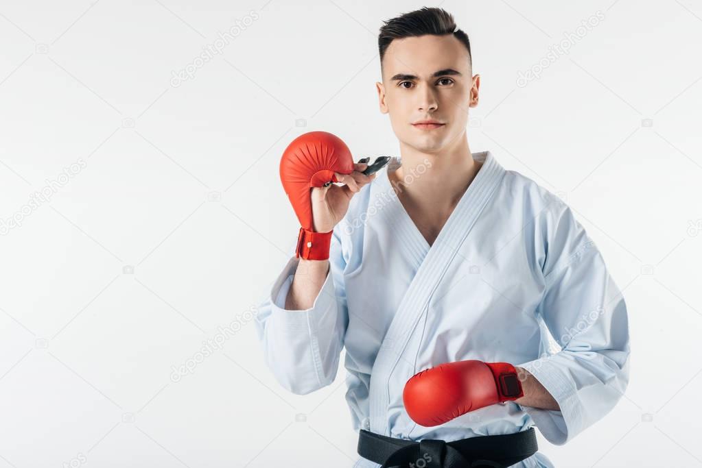 male karate fighter with mouthguard isolated on white