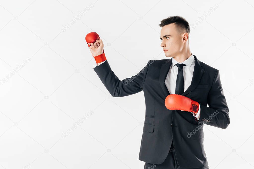 businessman in suit and red gloves isolated on white