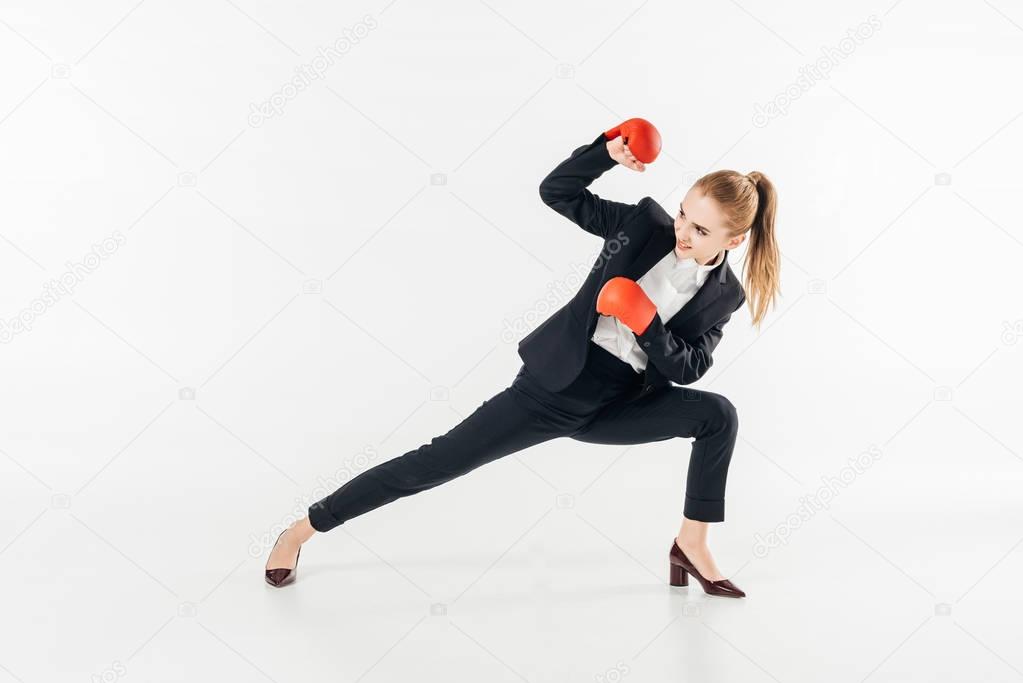 businesswoman in suit standing in block position isolated on white