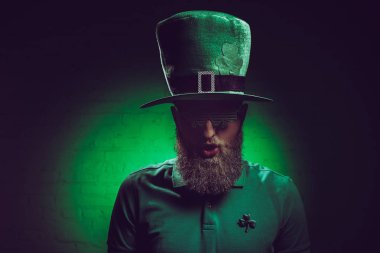 portrait of bearded young man in green irish hat and funny eyeglasses clipart