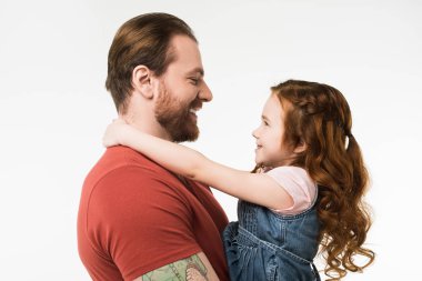 Side view of smiling father and daughter isolated on white clipart