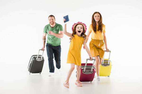 Happy running family with suitcases isolated on white, travel concept