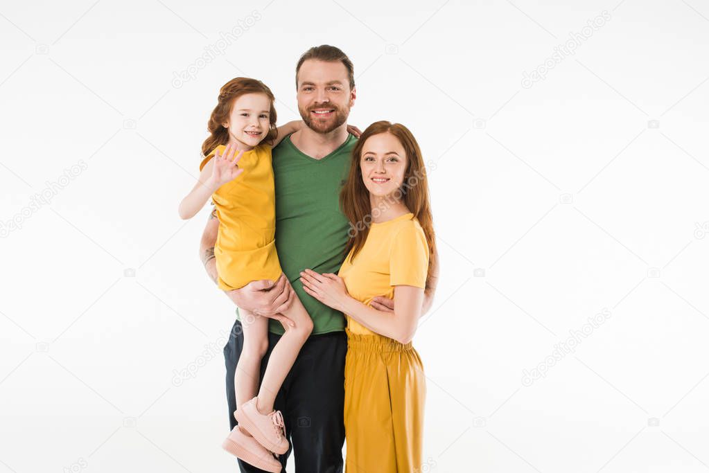 Portrait of smiling stylish family isolated on white