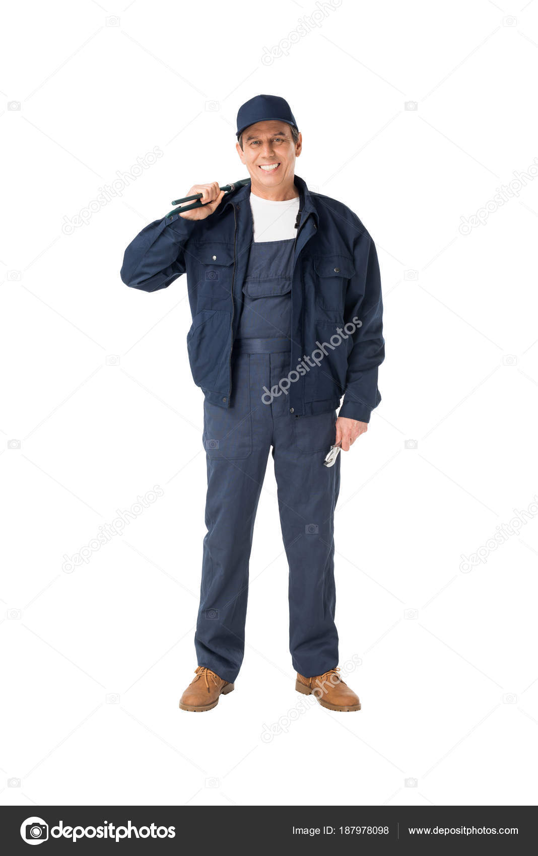 Handsome Plumber Overalls Holding Adjustable Wrenches Isolated White Stock Photo by