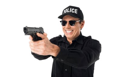 Smiling policeman aiming gun isolated on white clipart