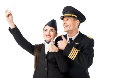 Smiling stewardess and pilot taking selfie isolated on white clipart