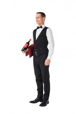 Male waiter serving bottle with wine isolated on white clipart