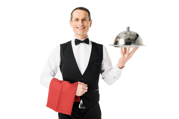 Elegant waiter holding serving tray with cover isolated on white