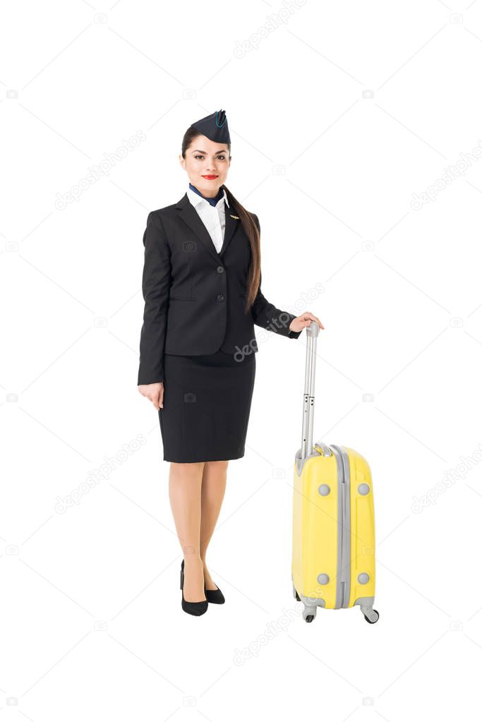 Stewardess in uniform holding suitcase isolated on white