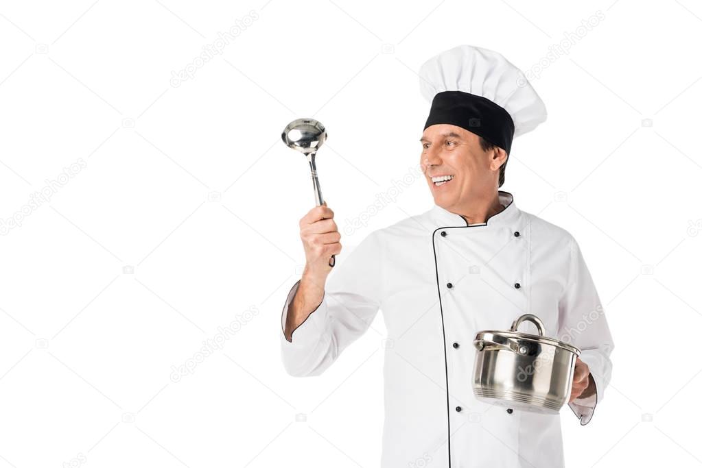 Man in chef uniform holding pan and ladle isolated on white