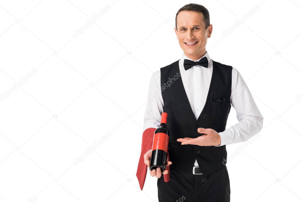 Male waiter serving bottle with wine isolated on white