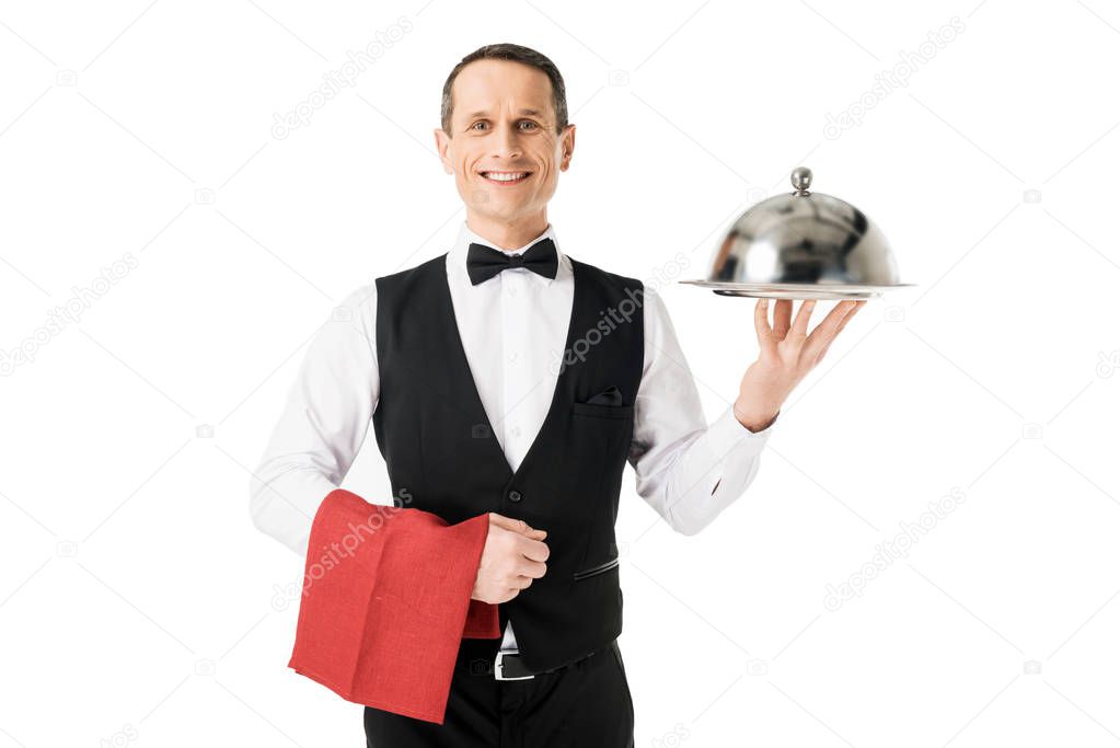 Elegant waiter holding serving tray with cover isolated on white