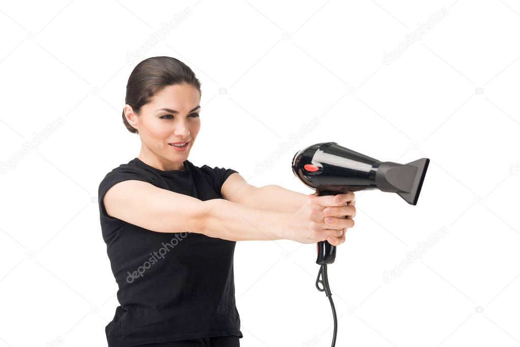 Woman hairdresser aiming with hairdryer isolated on white