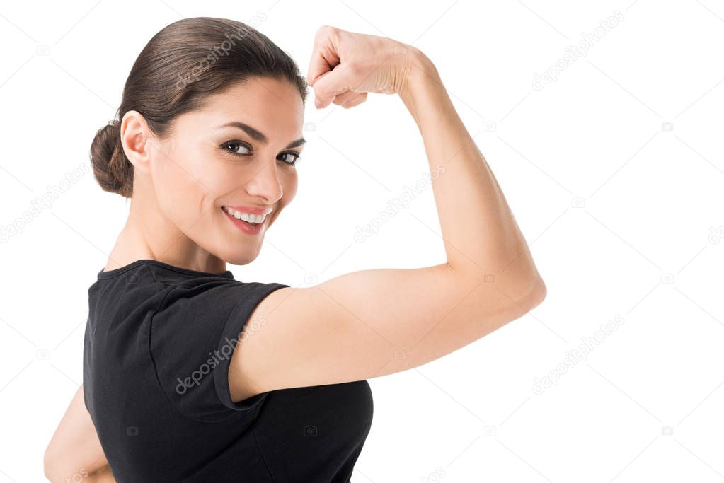Young woman showing female power gesture isolated on white