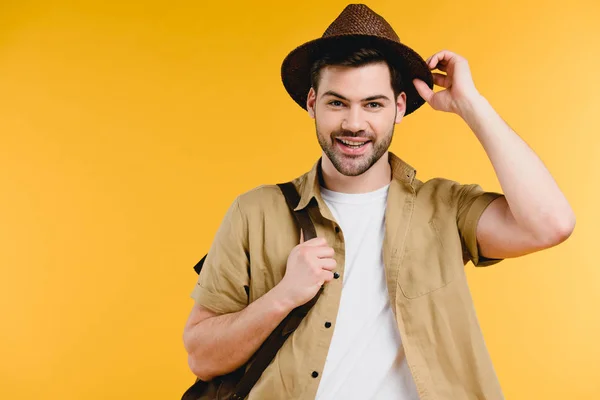 Handsome Young Man Adjusting Hat Smiling Camera Isolated Yellow — Stock Photo, Image