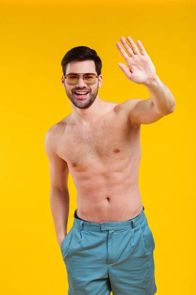 Handsome Shirtless Young Man Shorts Sunglasses Waving Hand Smiling Camera — Stock Photo, Image