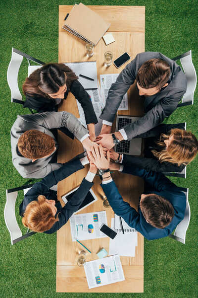 Top view of business partners at table in office, businesspeople teamwork collaboration relation concept