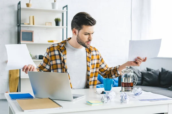 Man Working Laptop Holding Papers Light Office — Stock Photo, Image