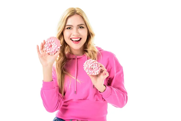 年轻女孩举行粉红色甜甜圈在白色隔离 — 图库照片