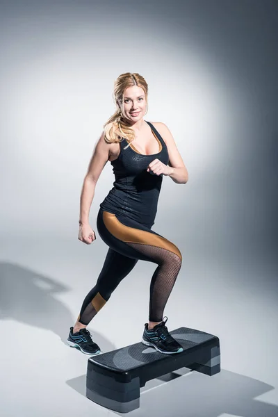 Blonde Woman Working Out Step Platform Grey Background — Stock Photo, Image