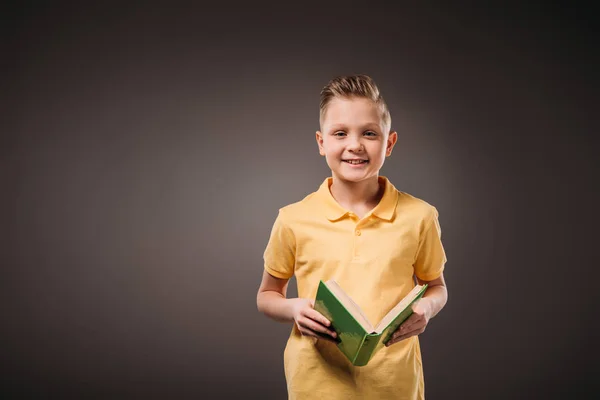 Preteen Boy Holding Book Isolato Grigio — Foto Stock