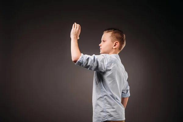 Preteen Boy Holding Something Isolated Grey — Stock Photo, Image